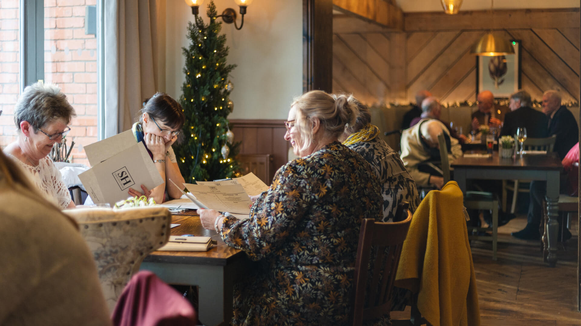 Customers looking at menus